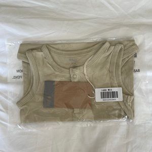 Kyte baby sleeveless body suit in wheat